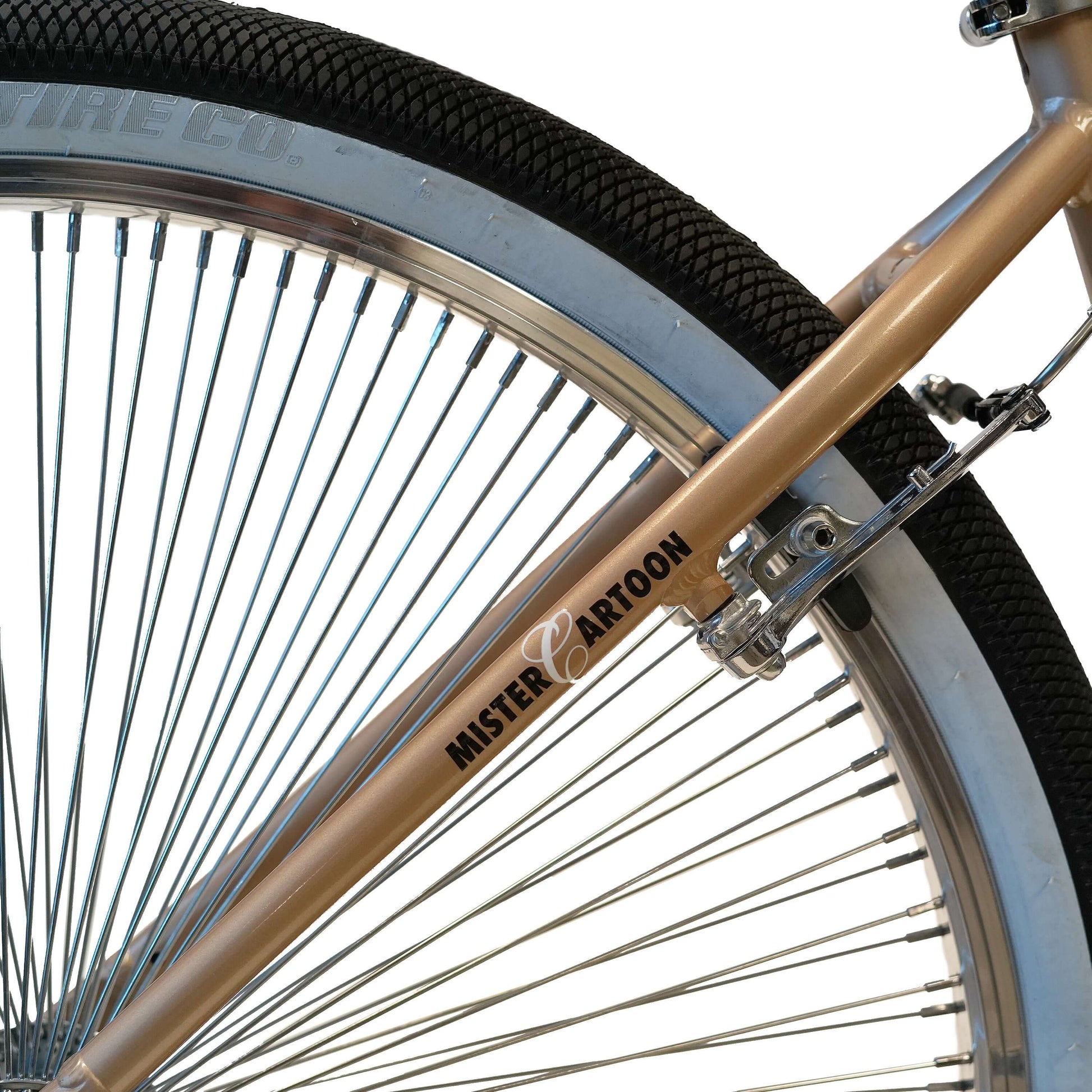 Close-up of Mister Cartoon branded bike frame showcasing spokes and tire design of the Throne BMX.