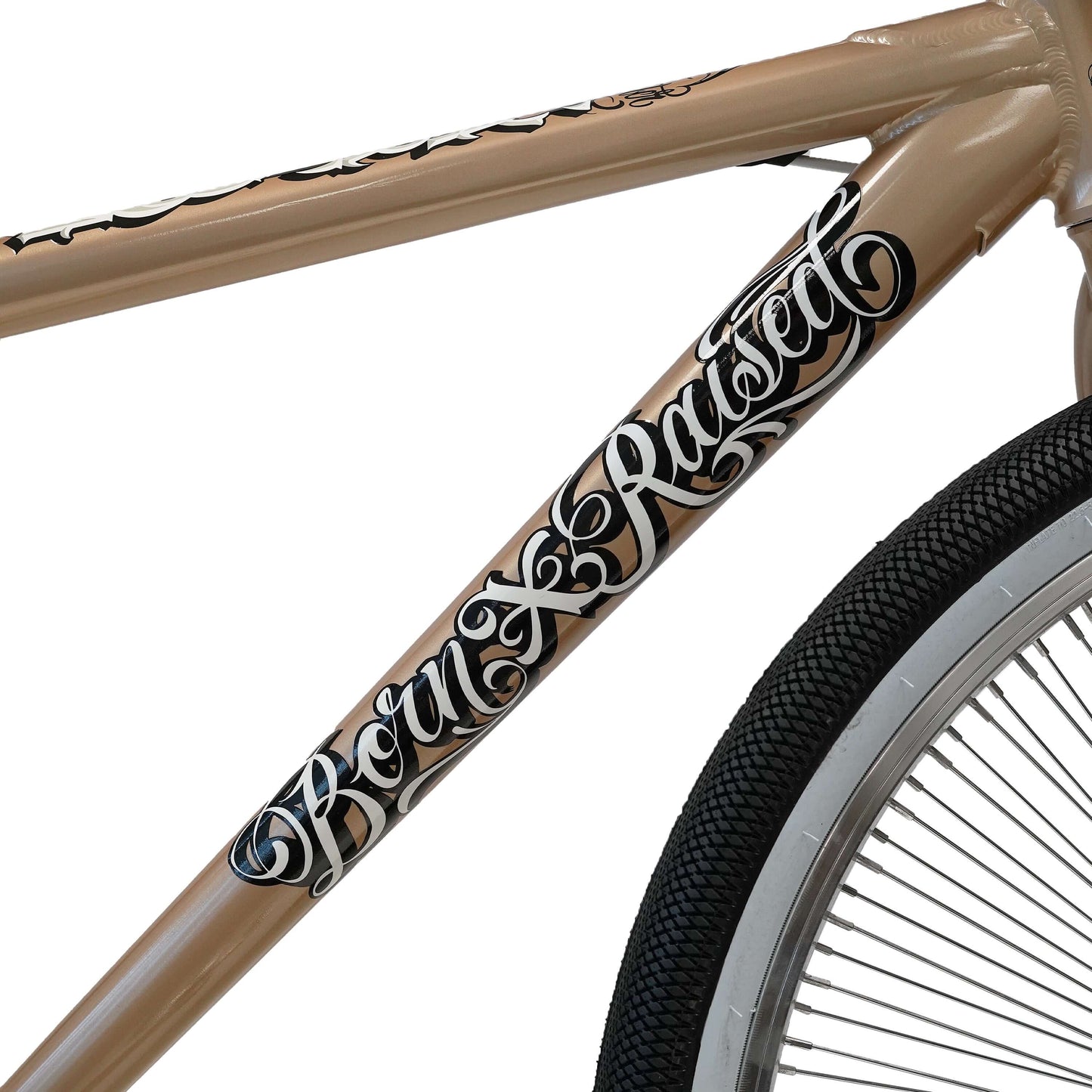 Close-up of Throne BMX bike frame featuring 'Born X Raised' artwork in stylish script.