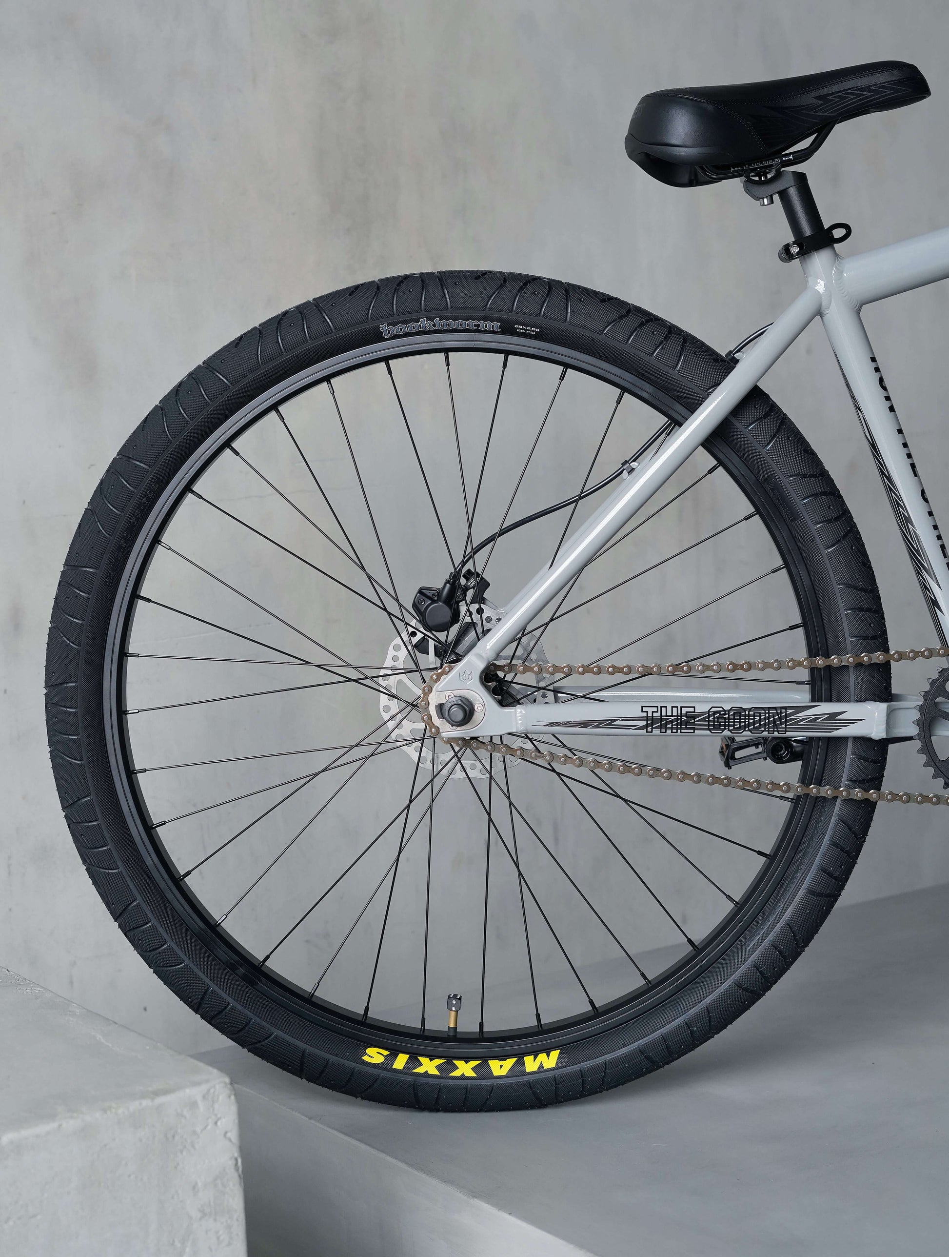 Close-up of the rear wheel of the Goon 29" BMX bike showcasing Maxxis tire and strong components.