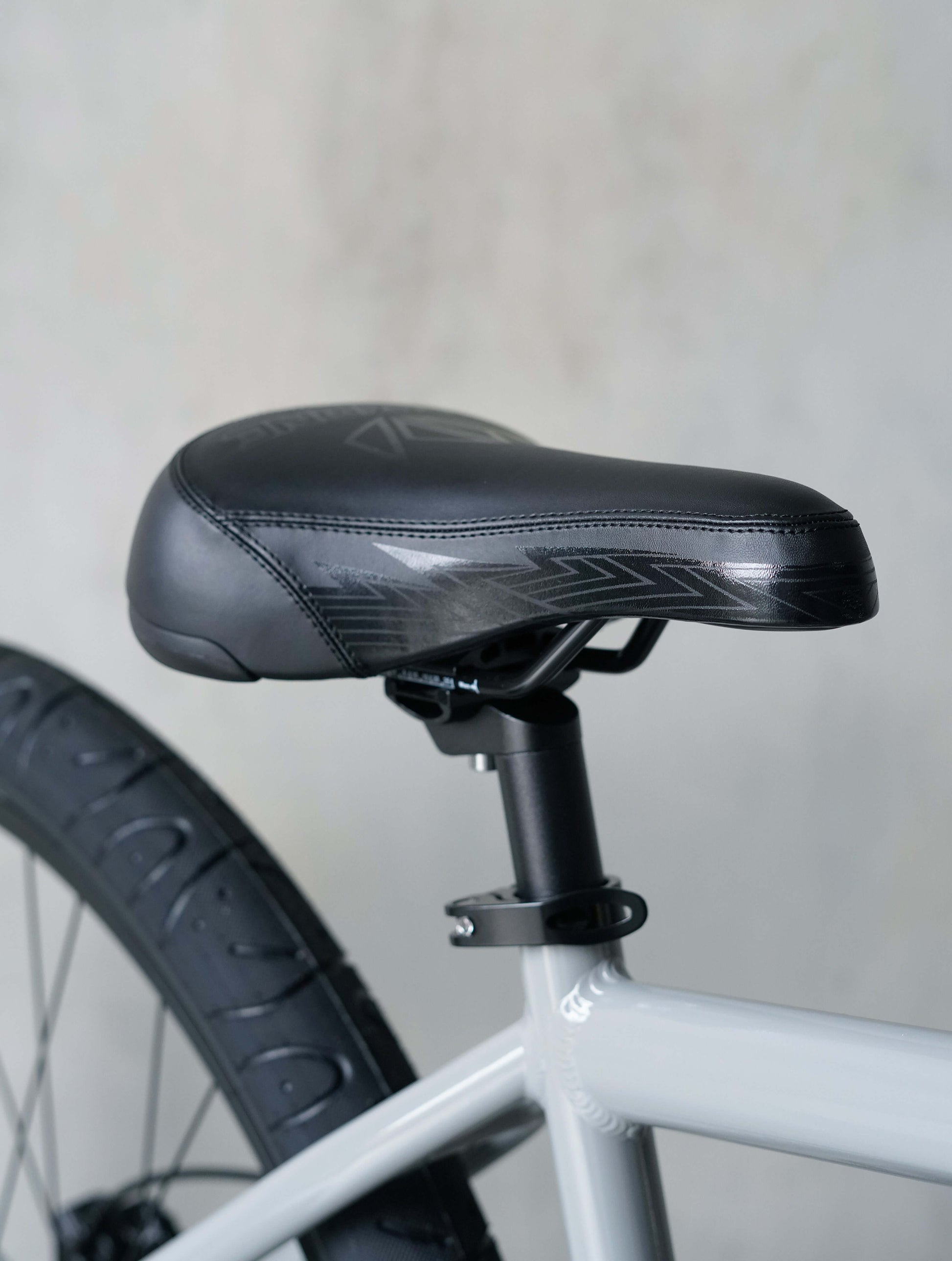 Close-up of the black saddle on the Throne Goon 29" BMX bike, showcasing design and comfort features.