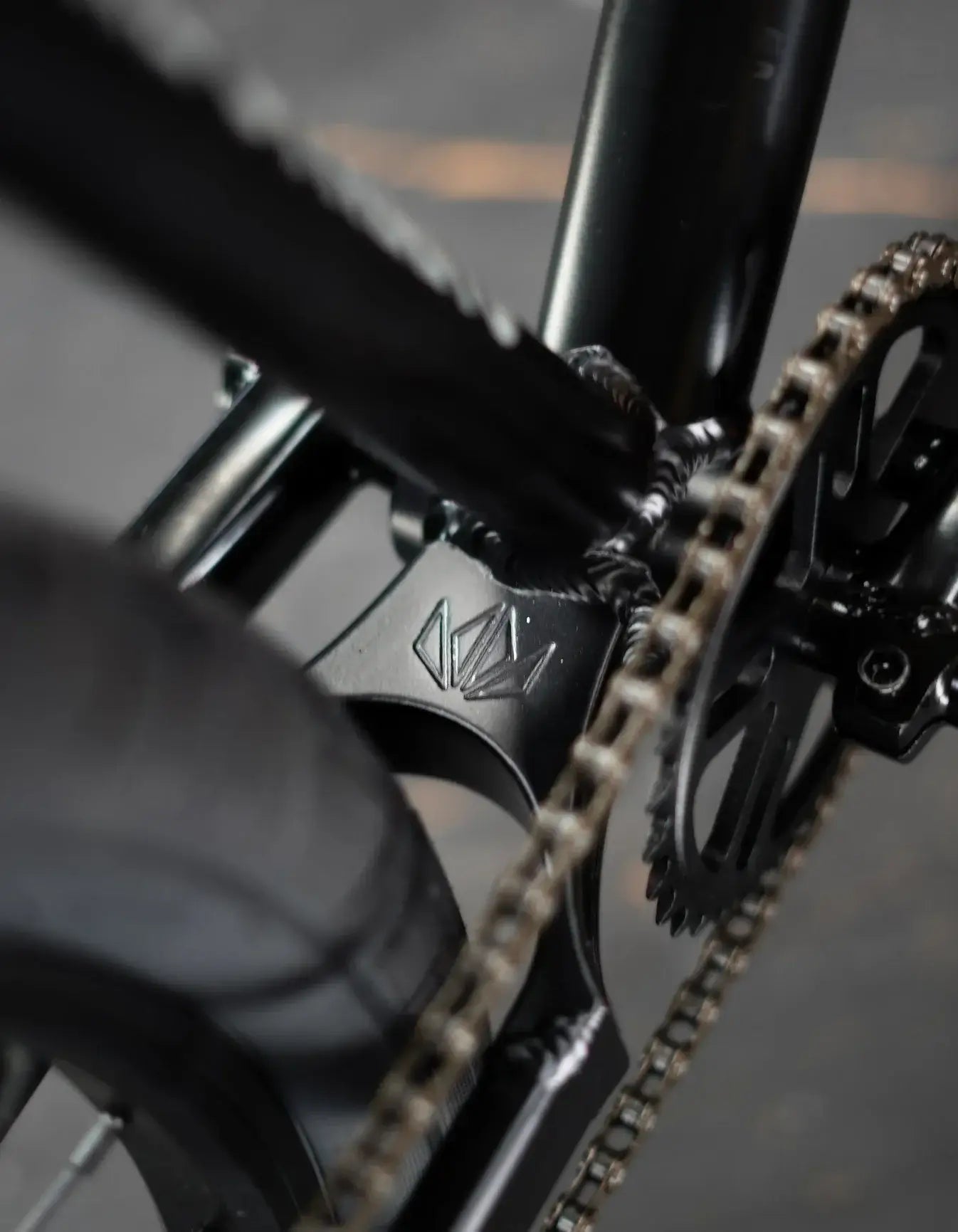 Close-up of the strong welded yoke and chain of the Throne Goon 29" BMX bike, showcasing durable design and components.