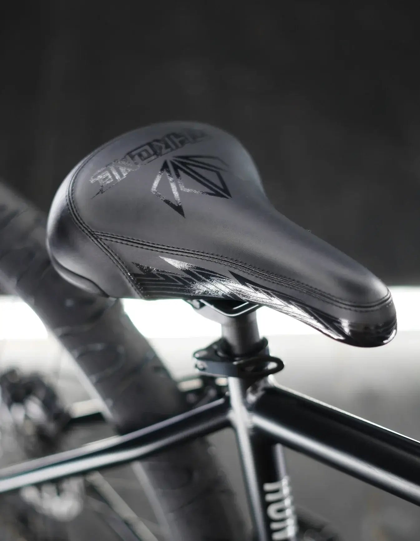 Close-up of the sleek black seat on the Throne Goon 29" BMX bike, showcasing its durability and style.