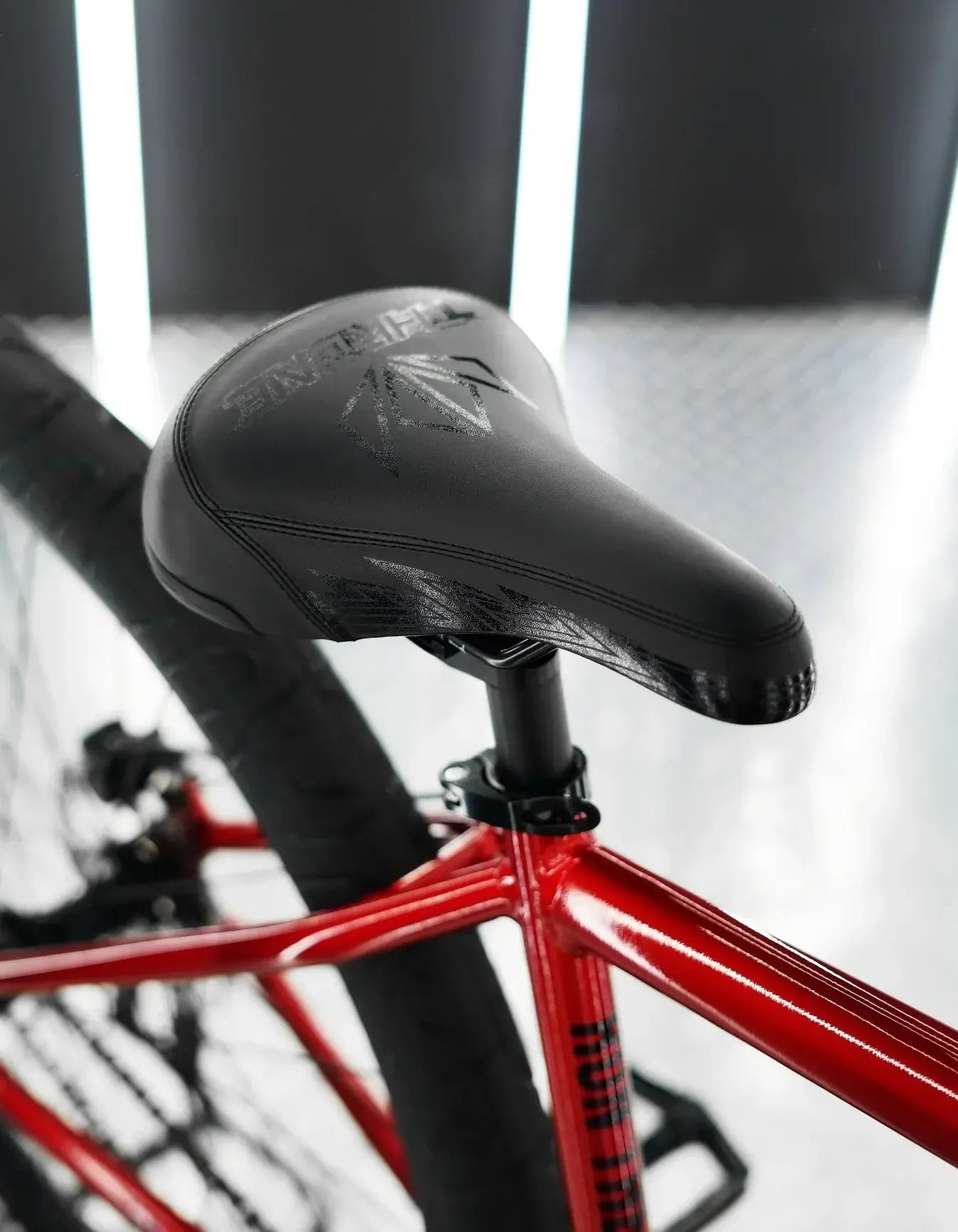 Close-up of the black seat on the Throne The Goon 29" BMX bike, showcasing its sleek design and sturdy build.