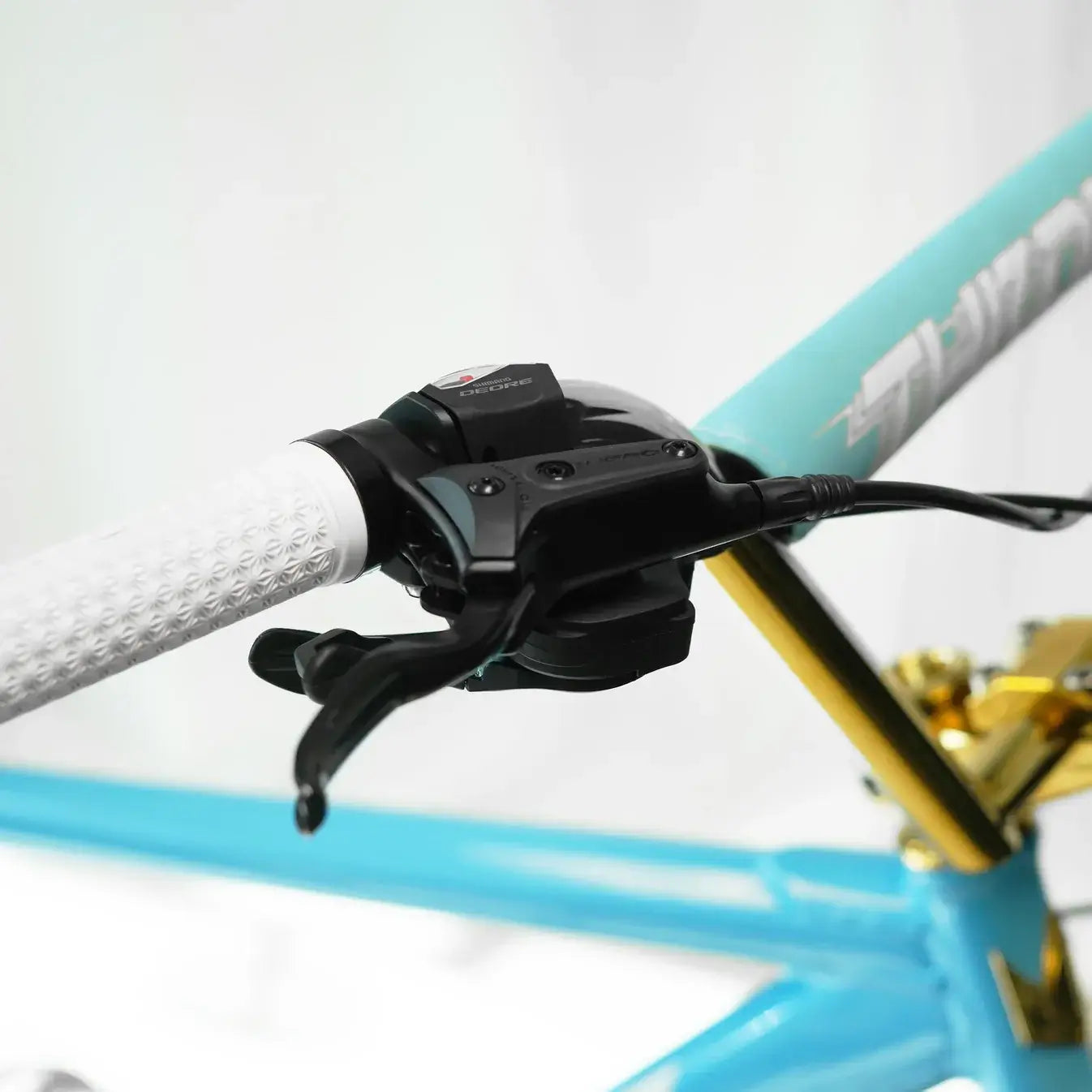 Close-up of the handlebar and brake levers on the Throne The Goon Runner BMX bike, showcasing its high-quality components.