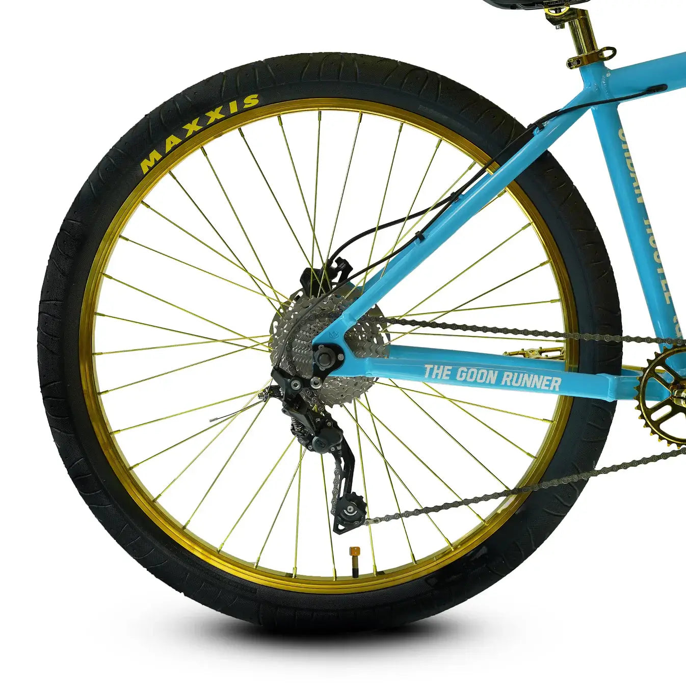 Close-up of Throne The Goon Runner BMX bike rear wheel, featuring gold spokes and a Deore 10-speed derailleur.