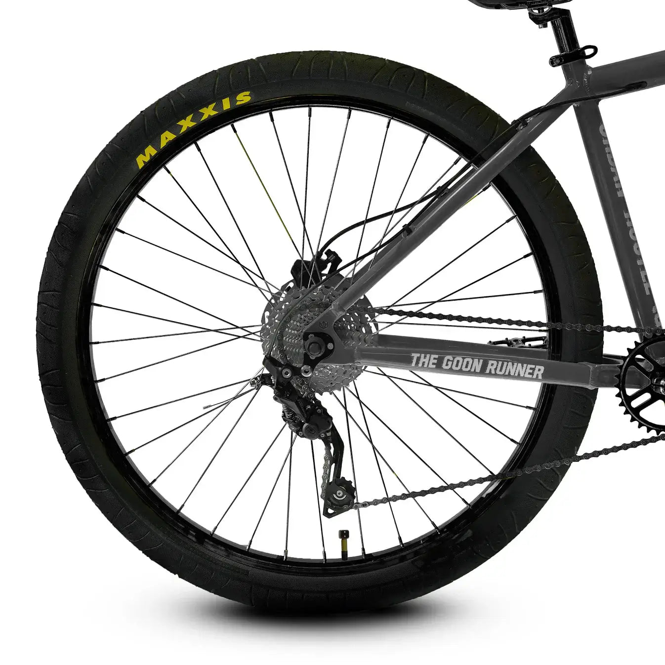 Close-up of The Goon Runner BMX bike wheel showcasing MAXXIS tire and Deore 10-speed derailleur for enhanced performance.