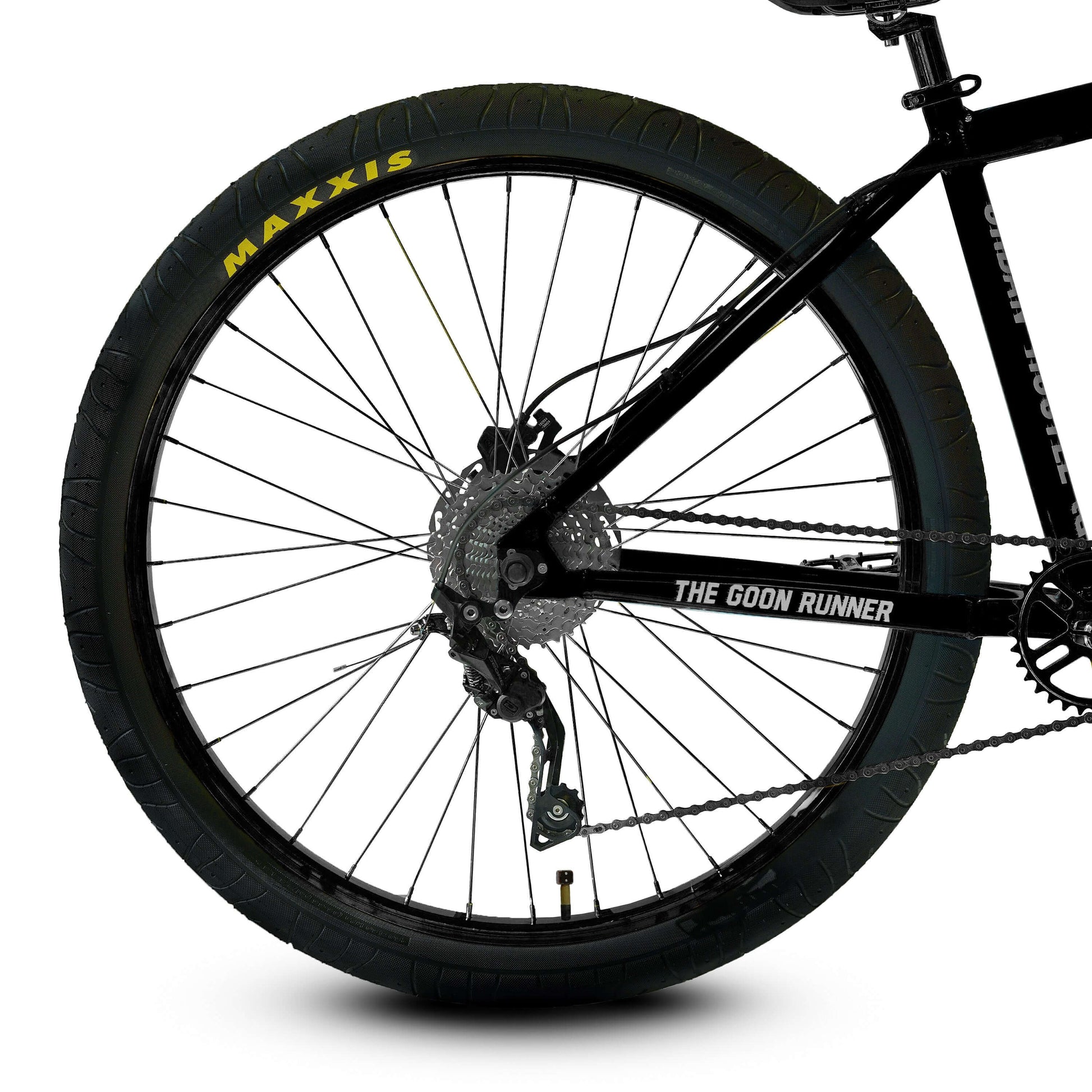 Close-up of The Goon Runner BMX bike wheel showcasing Maxxis tire and Deore 10-speed derailleur.