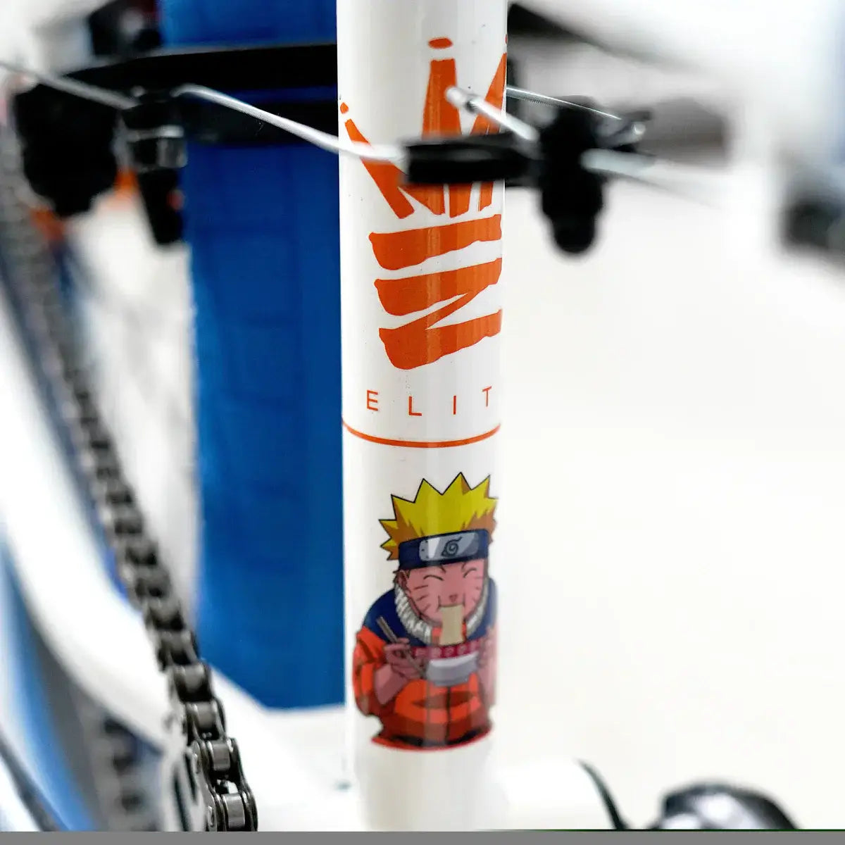 Close-up of Elite BMX bike frame featuring Naruto design and logo, showcasing vibrant colors and iconic graphics.
