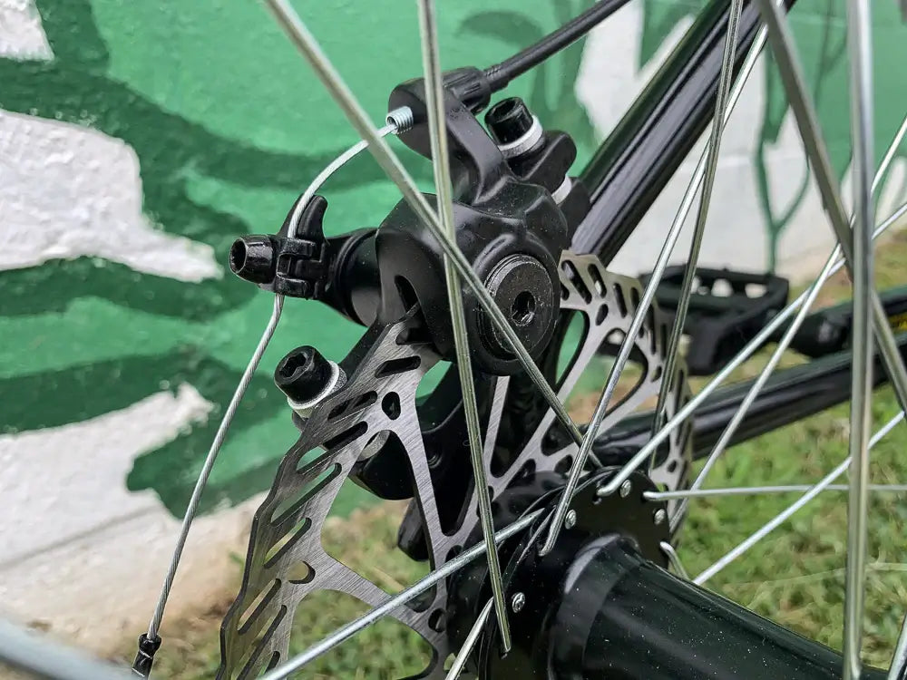 Close-up of Eastern Bike Big Reaper mechanical disc brake and hub, showcasing high-quality components for smooth rides.