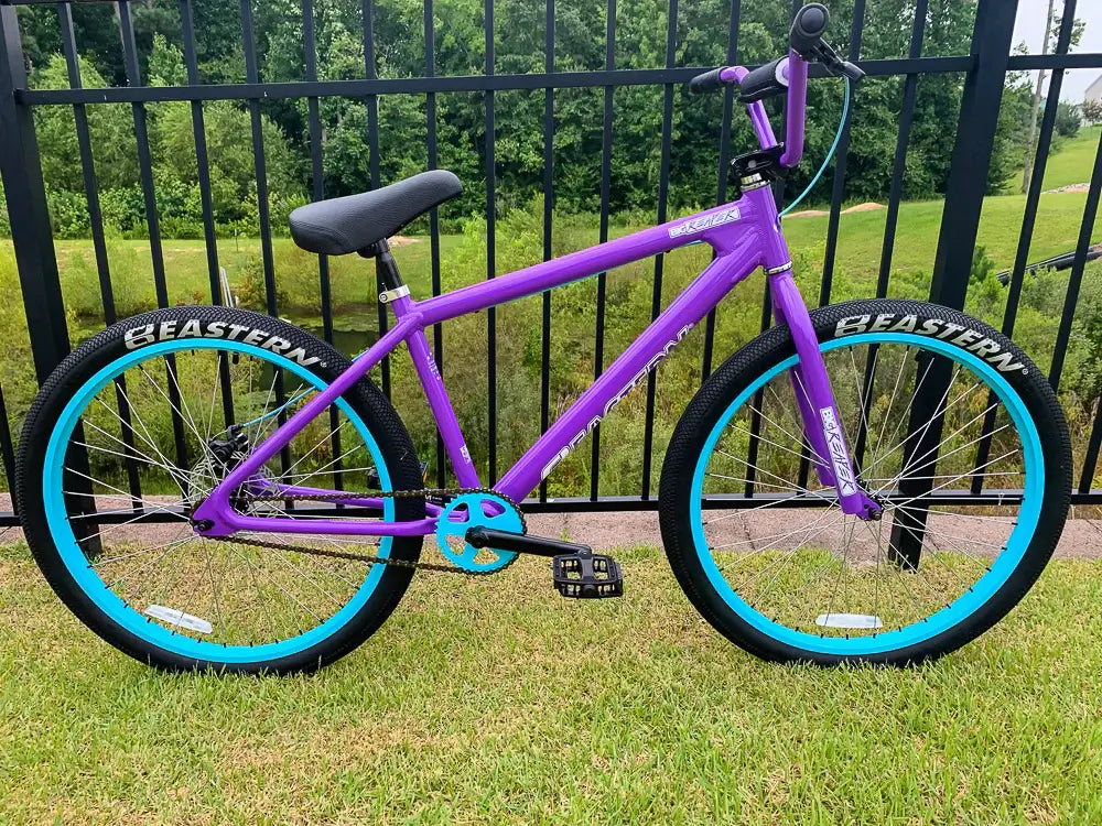 Eastern Bike Big Reaper LTD in vibrant purple with blue tires, perfect for street riding and wheelies, featuring durable components.