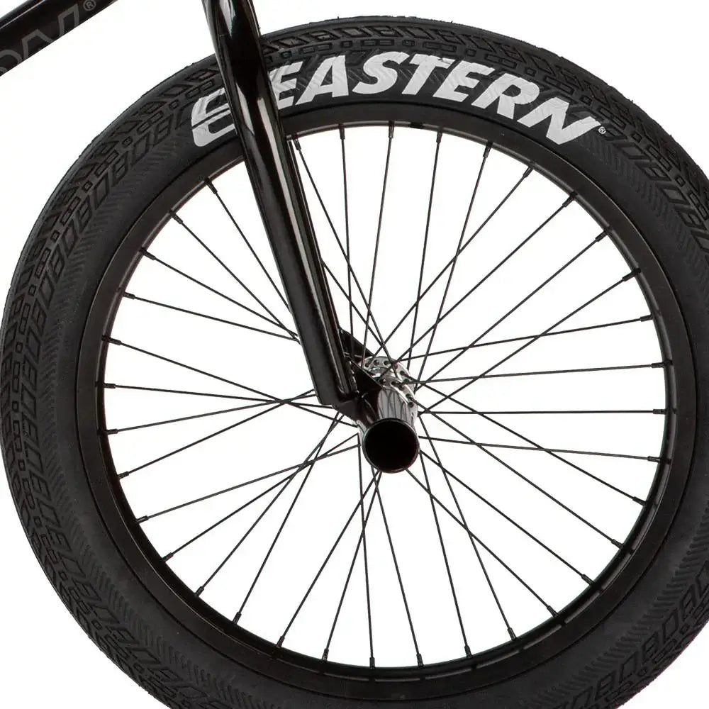 Close-up of Eastern bike tire showcasing its tread and branding, emphasizing quality performance for BMX riders.