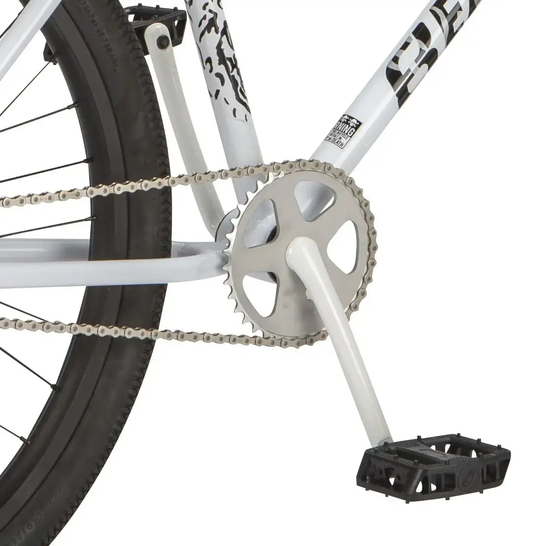 Close-up of Eastern Bike Growler's alloy sprocket, pedals, and steel frame, showcasing its BMX design and durability.