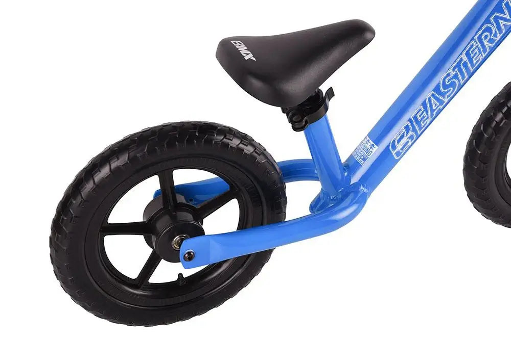 Close-up of Eastern Pusher Balance Bike showing lightweight frame, adjustable seat, and durable wheels.