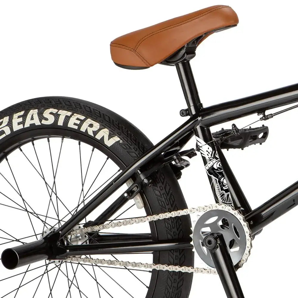 Close-up of Eastern Bike Shovelhead's rear with chromoly frame, brown seat, and Squealer tires.