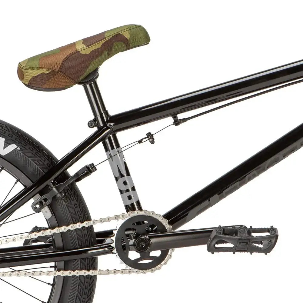 Eastern Wolfdog bike close-up showing chromoly frame, camo seat, and Squealer tires.