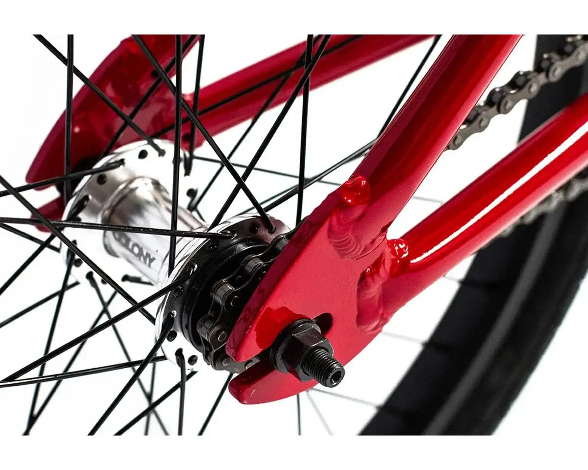 Close-up view of the Colony Horizon BMX bike's rear hub and chainstay in striking red color.