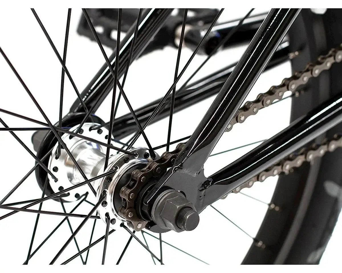 Close-up of the rear hub and chain on a Colony Emerge 20" BMX bike, showcasing its durable design and components.