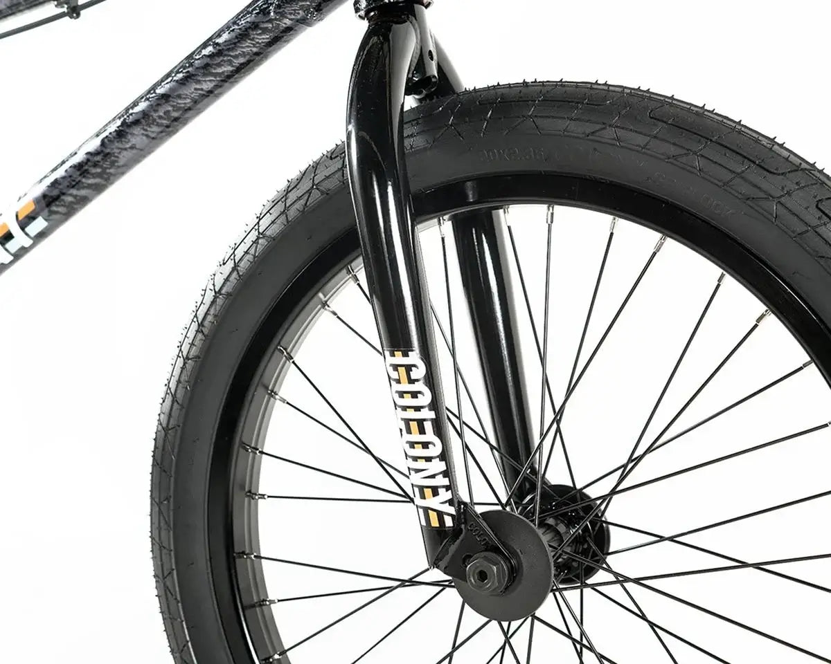 Close-up of the Colony Premise BMX Bike's front fork and tire design, showcasing its sturdy construction and sleek style.