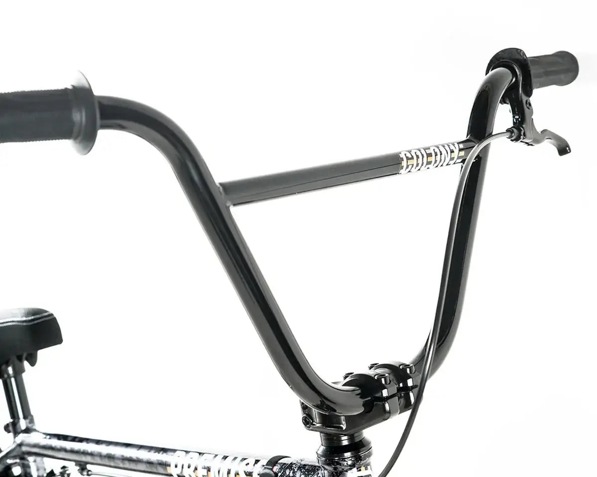 Close-up of Colony Premise BMX bike handlebars showcasing chromoly construction and integrated headset.