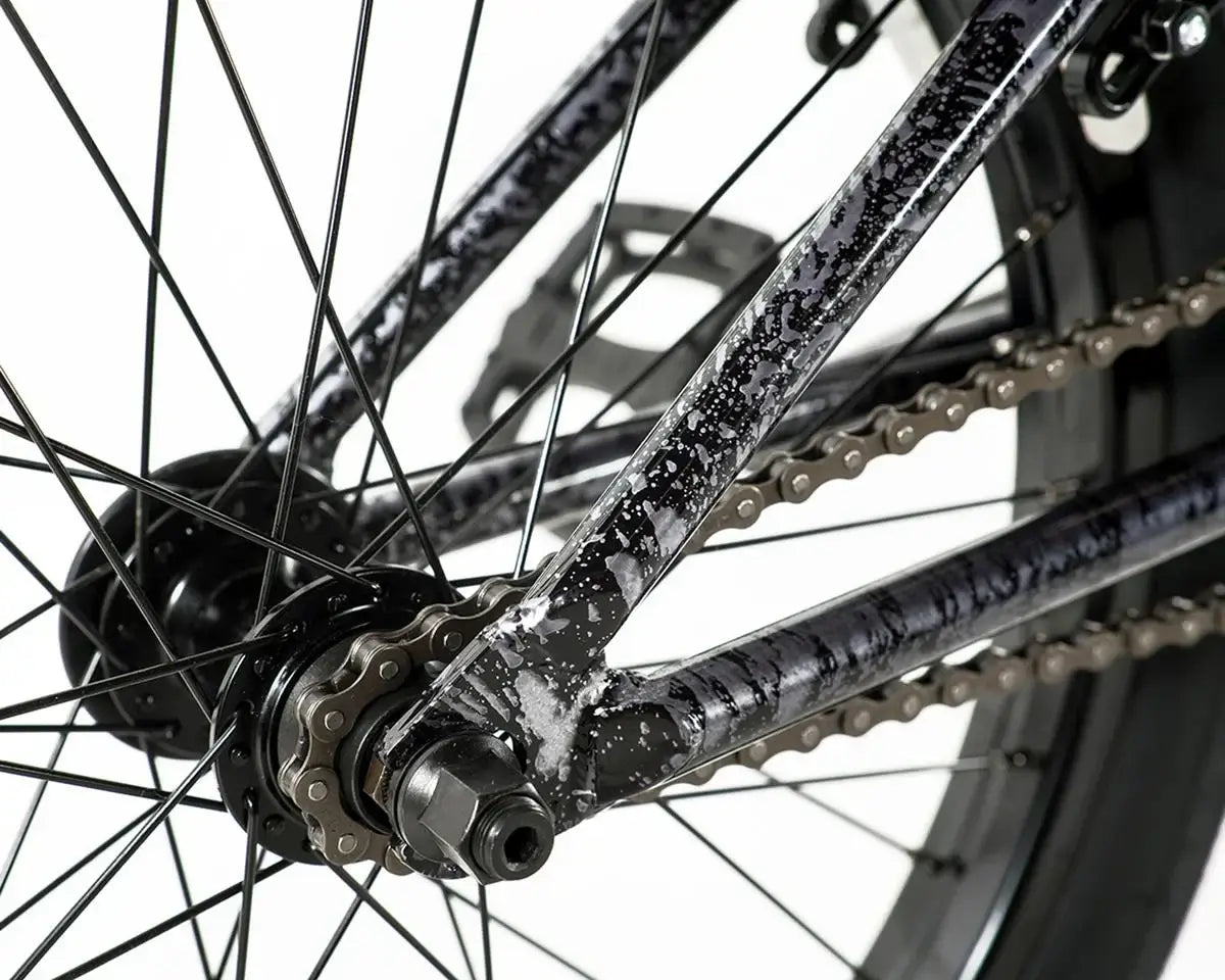 Close-up of the rear frame and hub of a Colony Premise BMX bike showcasing detailed chromoly construction and chain.