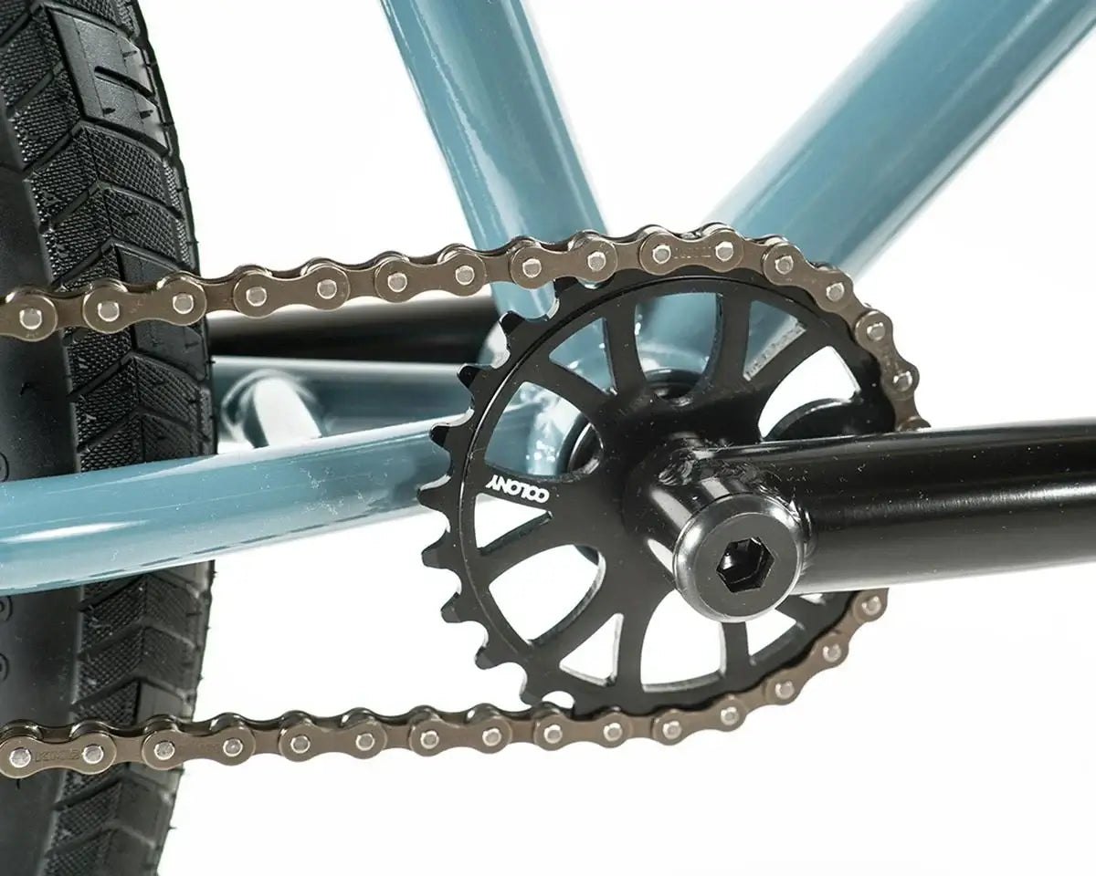Close-up of the chain and sprocket on a Colony Eclipse 26" BMX bike, showcasing its durable construction.