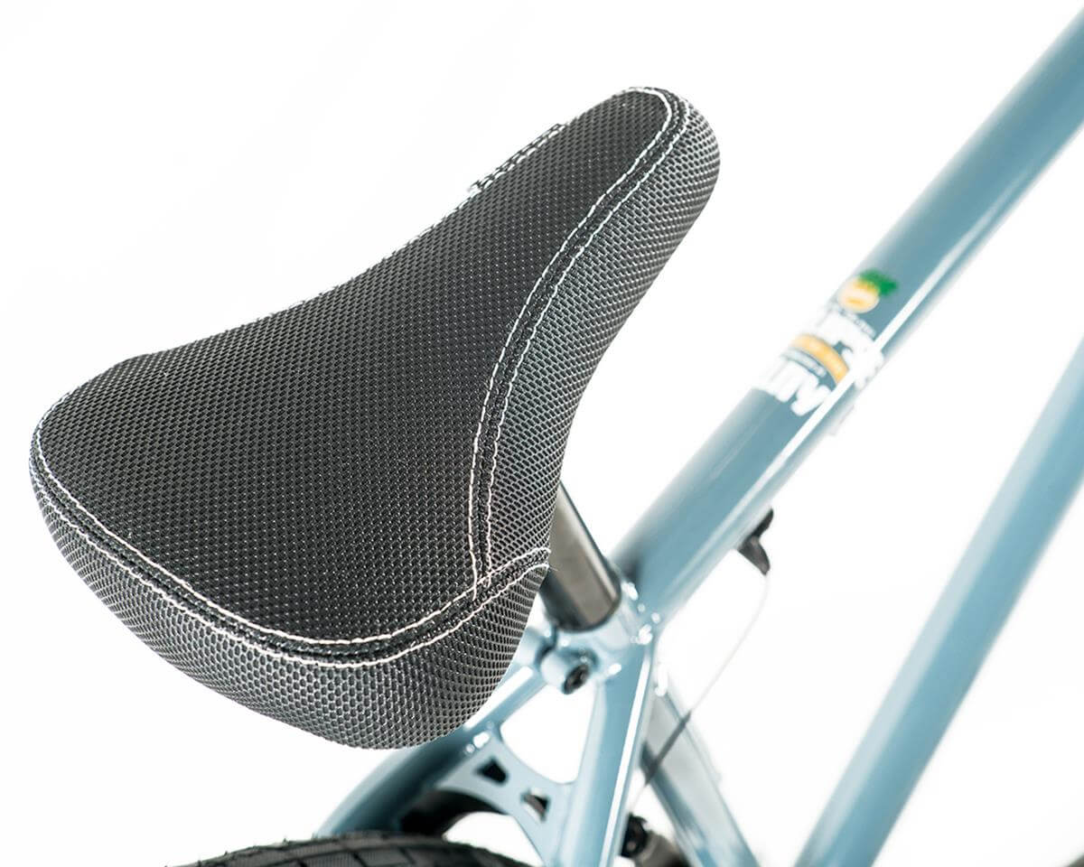 Close-up of the comfortable black BMX bike seat on the Colony Eclipse 26" featuring textured surface and stitched detail.