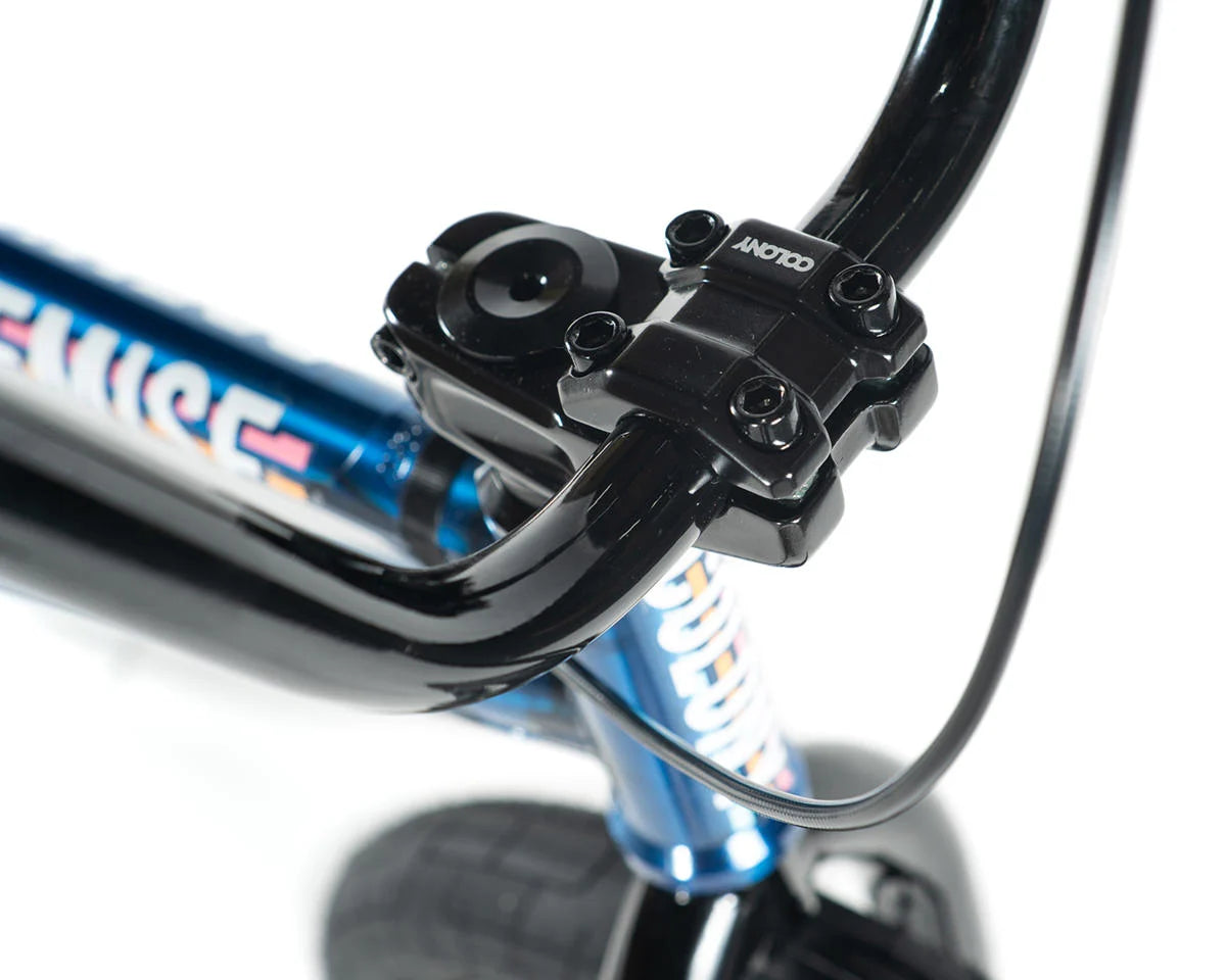 Close-up of Colony Premise BMX bike handlebars and stem, featuring chromoly construction and integrated headset.