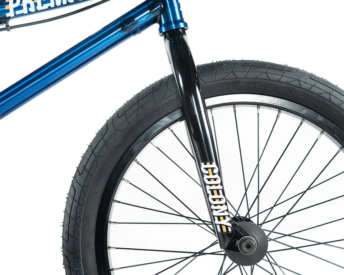 Close-up of Colony Premise BMX bike front fork and tire showcasing full chromoly design and sleek graphics.