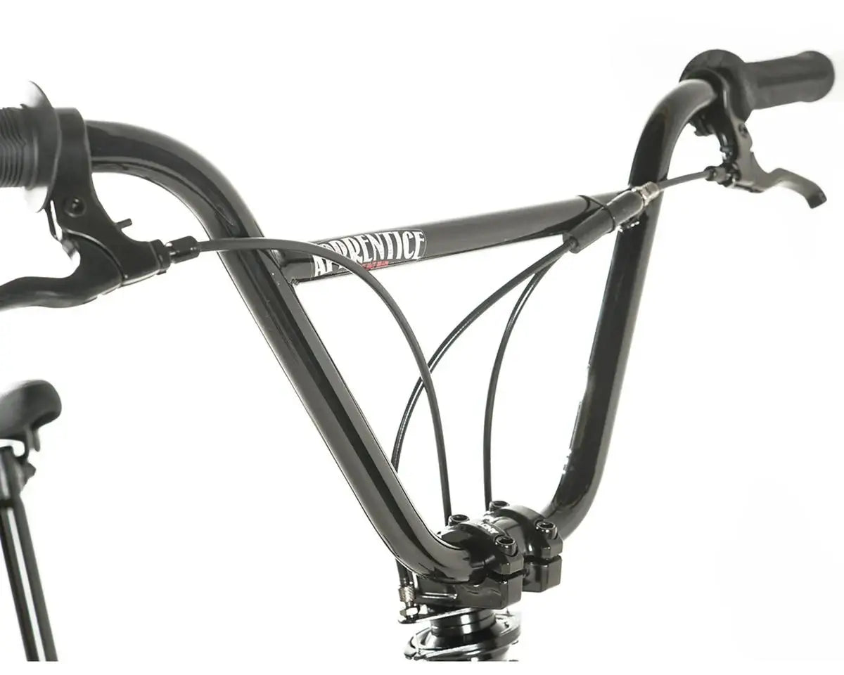 Close-up of Colony Apprentice BMX bike handlebars showcasing sleek design and cable features.