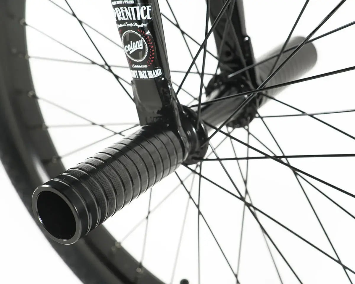 Close-up of Colony Apprentice BMX bike fork and grips, showcasing flatland design and features.