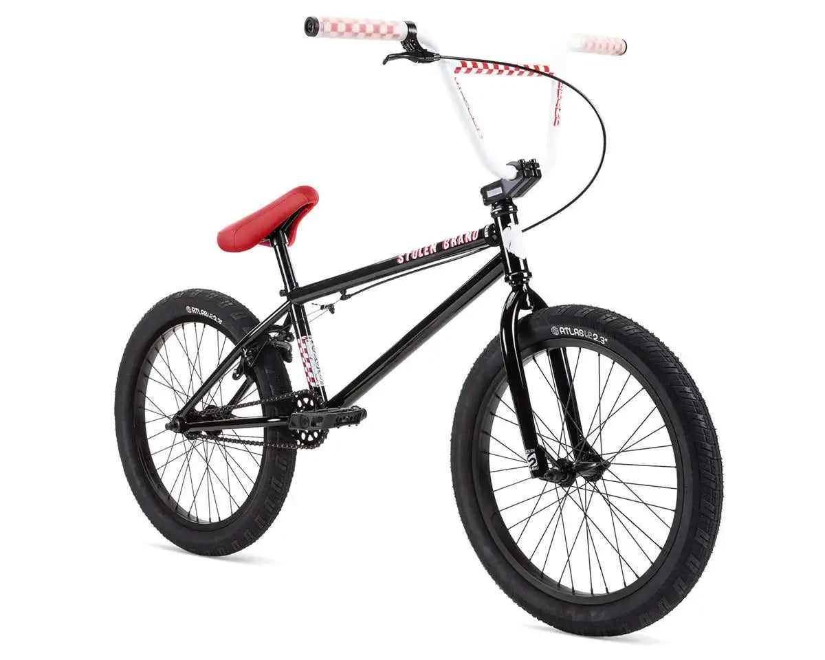 Stolen Stereo 20" BMX bike with black frame, red seat, and unique handlebars for a smooth ride.