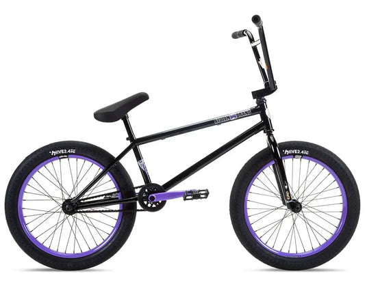 Stolen Sinner FC XLT 20" BMX bike in black and purple, featuring a freecoaster hub and chromoly components.