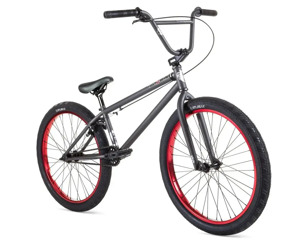 Stolen Saint 24" BMX bike with red rims and full chromoly frame, ideal for cruising and BMX riding.
