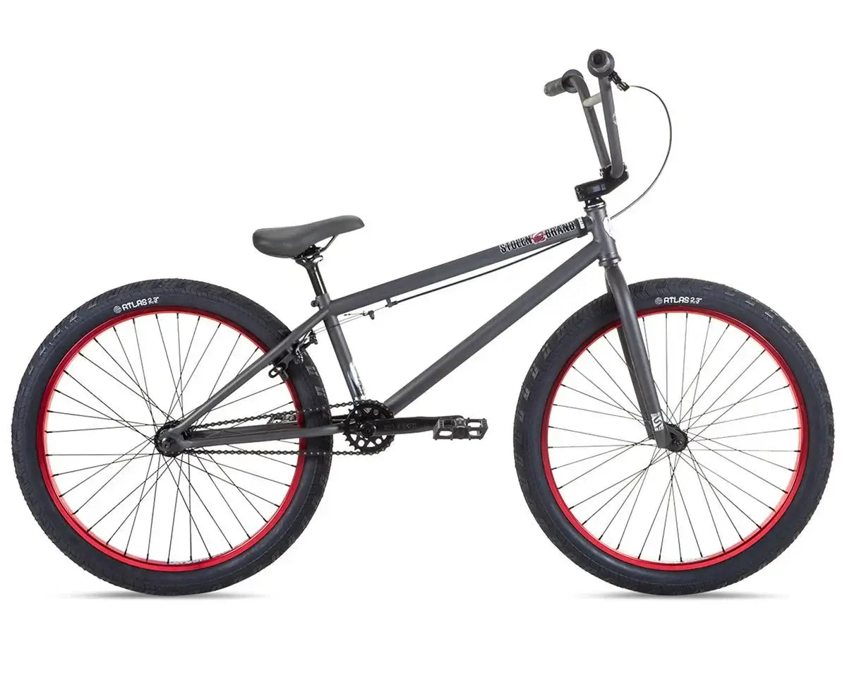 Stolen Saint 24" BMX bike with 24" rims, chromoly frame, and red accents, ideal for riders 5'9" and taller.