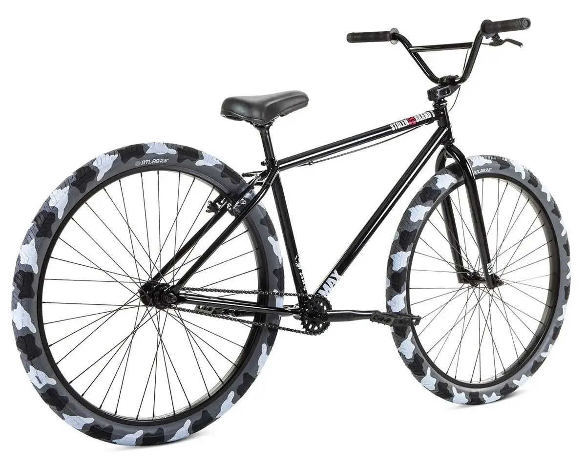 Stolen Max 29" bike with black frame and camo patterned tires, ideal for commuting and casual rides.