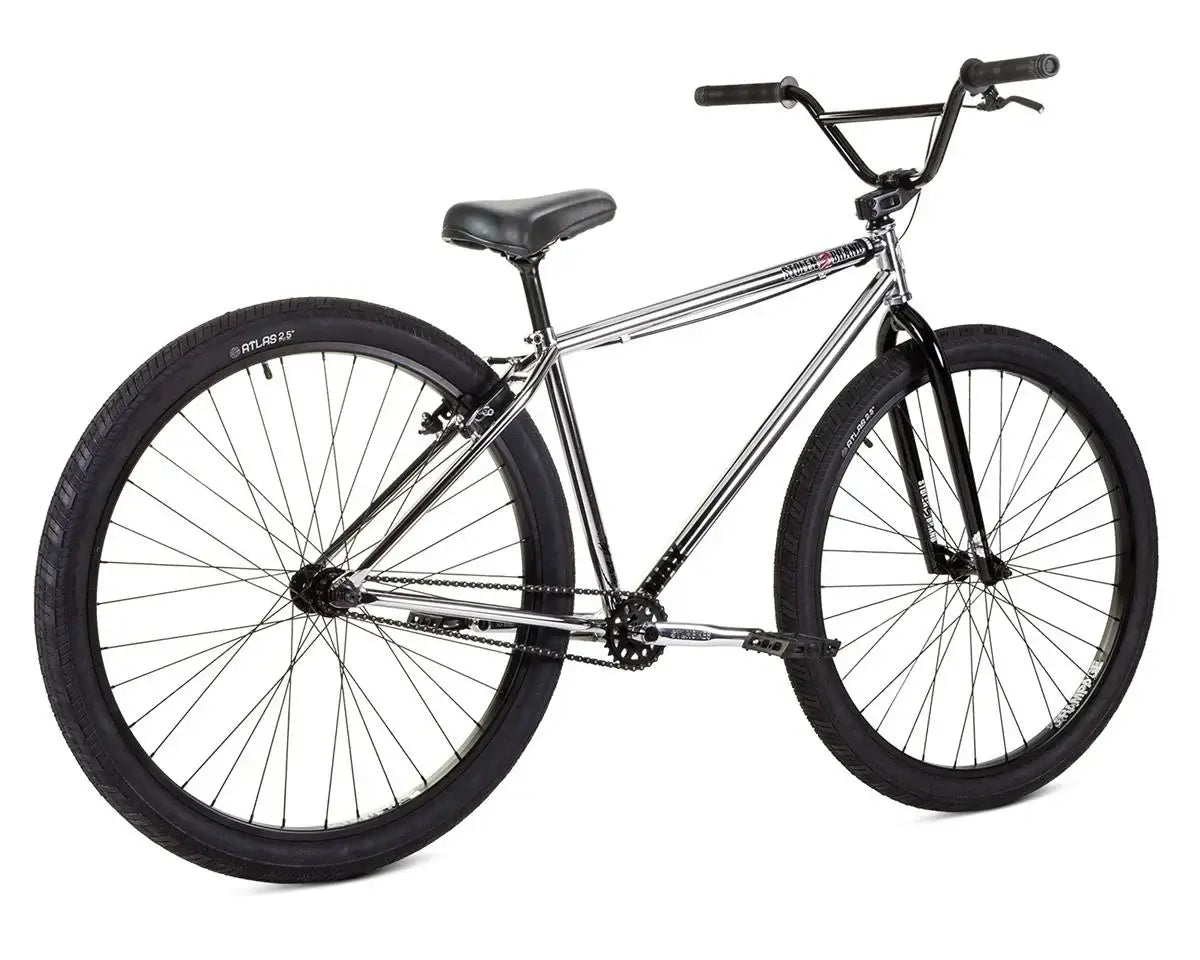 Stolen Max 29" bike features sleek design and durable black tires, perfect for commuting and cruising.