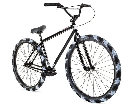 Stolen Max 29" Bike with black frame and camouflage patterned tires for smooth cruising and commuting.