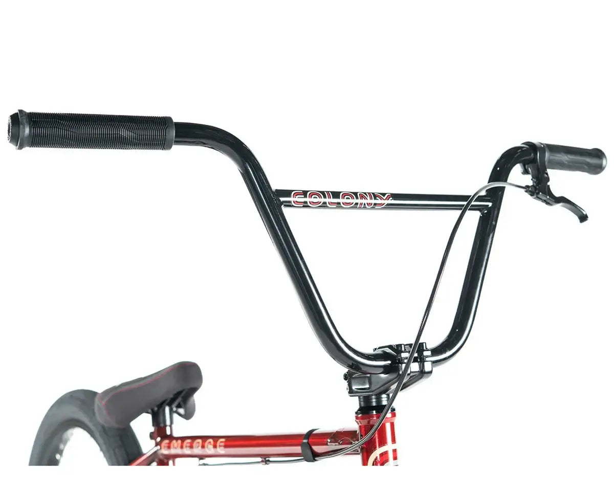 Close-up of Colony Emerge BMX bike handlebars with grips and brake lever.