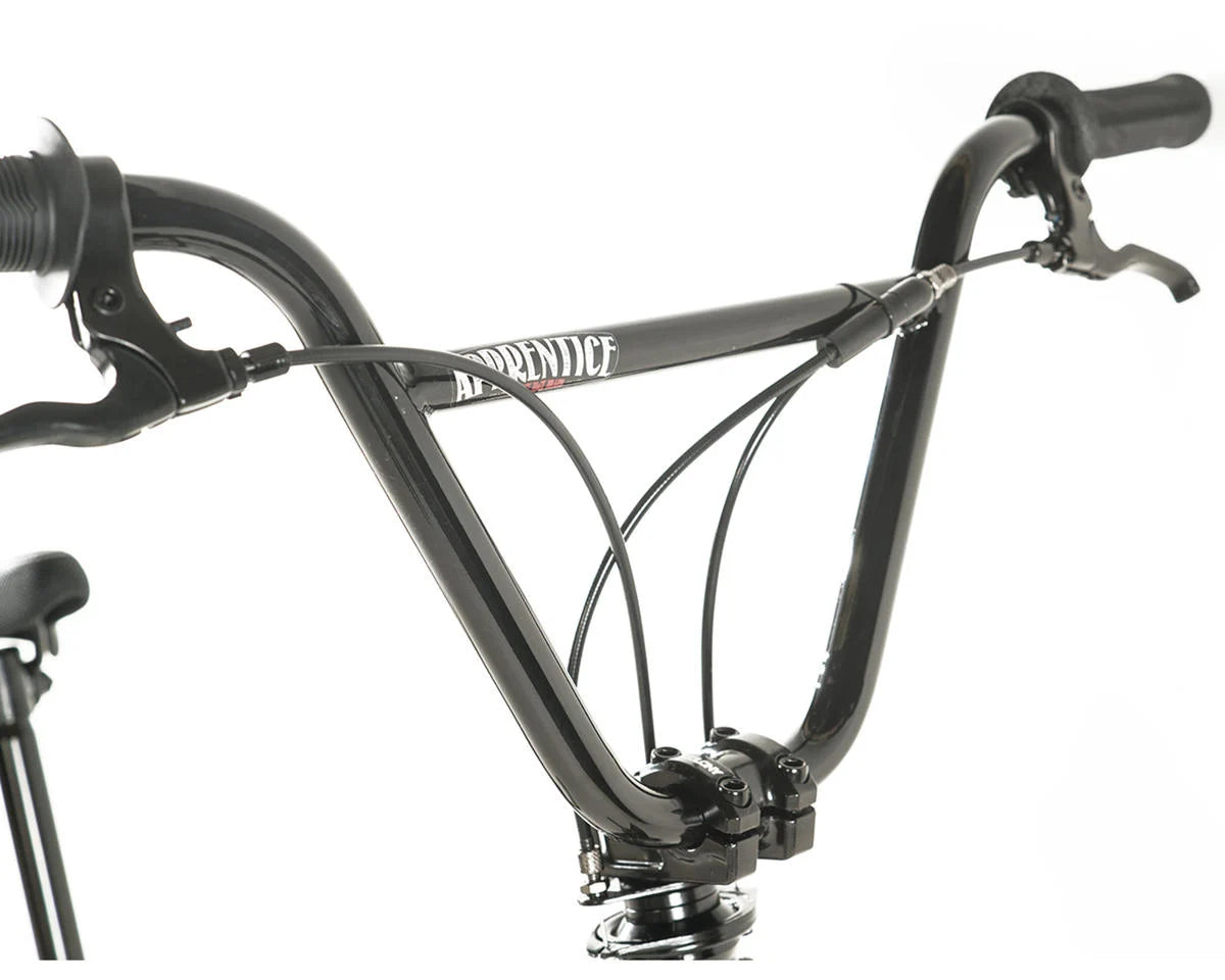 Close-up of Colony Apprentice BMX bike handlebars showcasing sleek design and cable features.