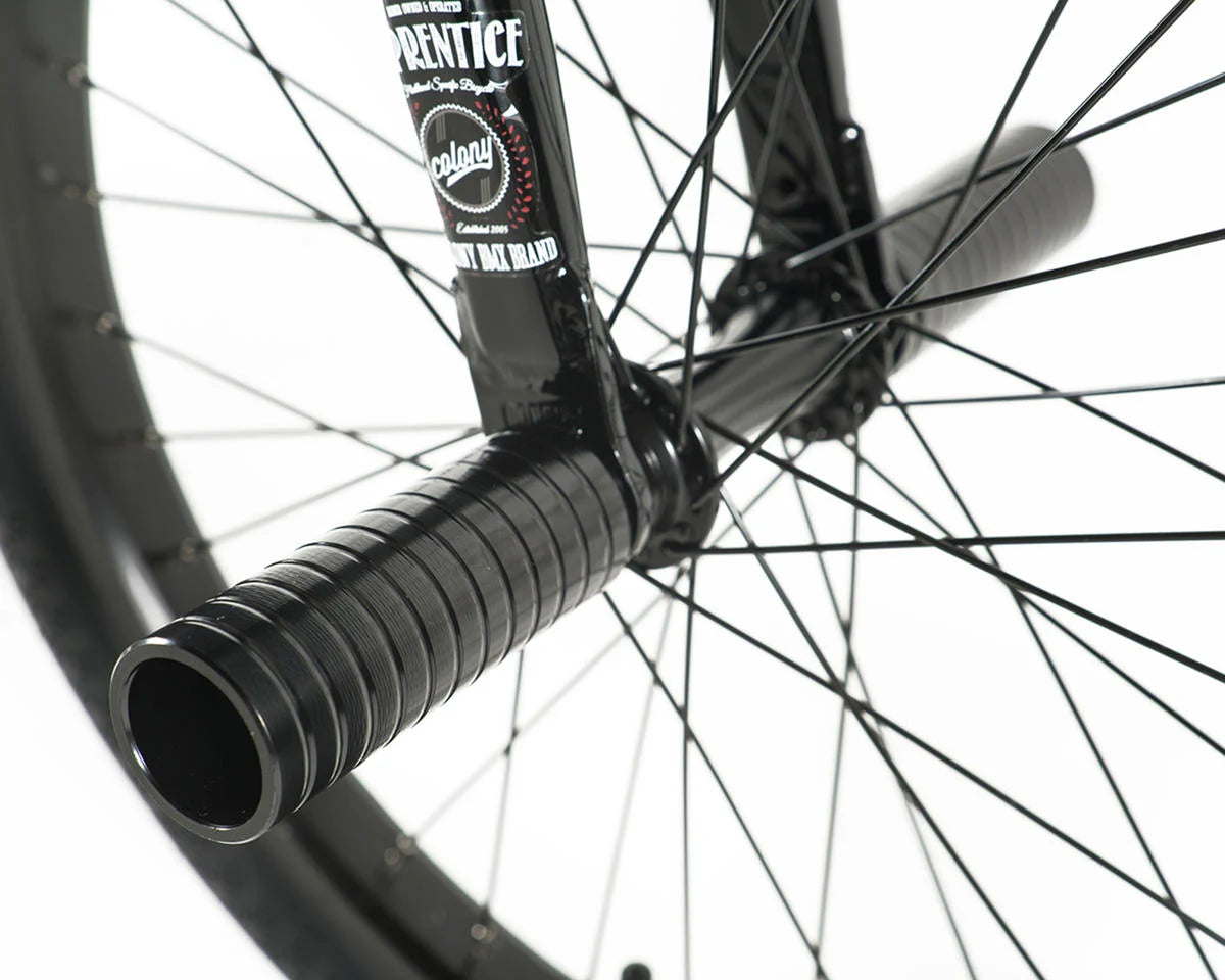 Close-up of Colony Apprentice BMX bike fork and grips, showcasing flatland design and features.